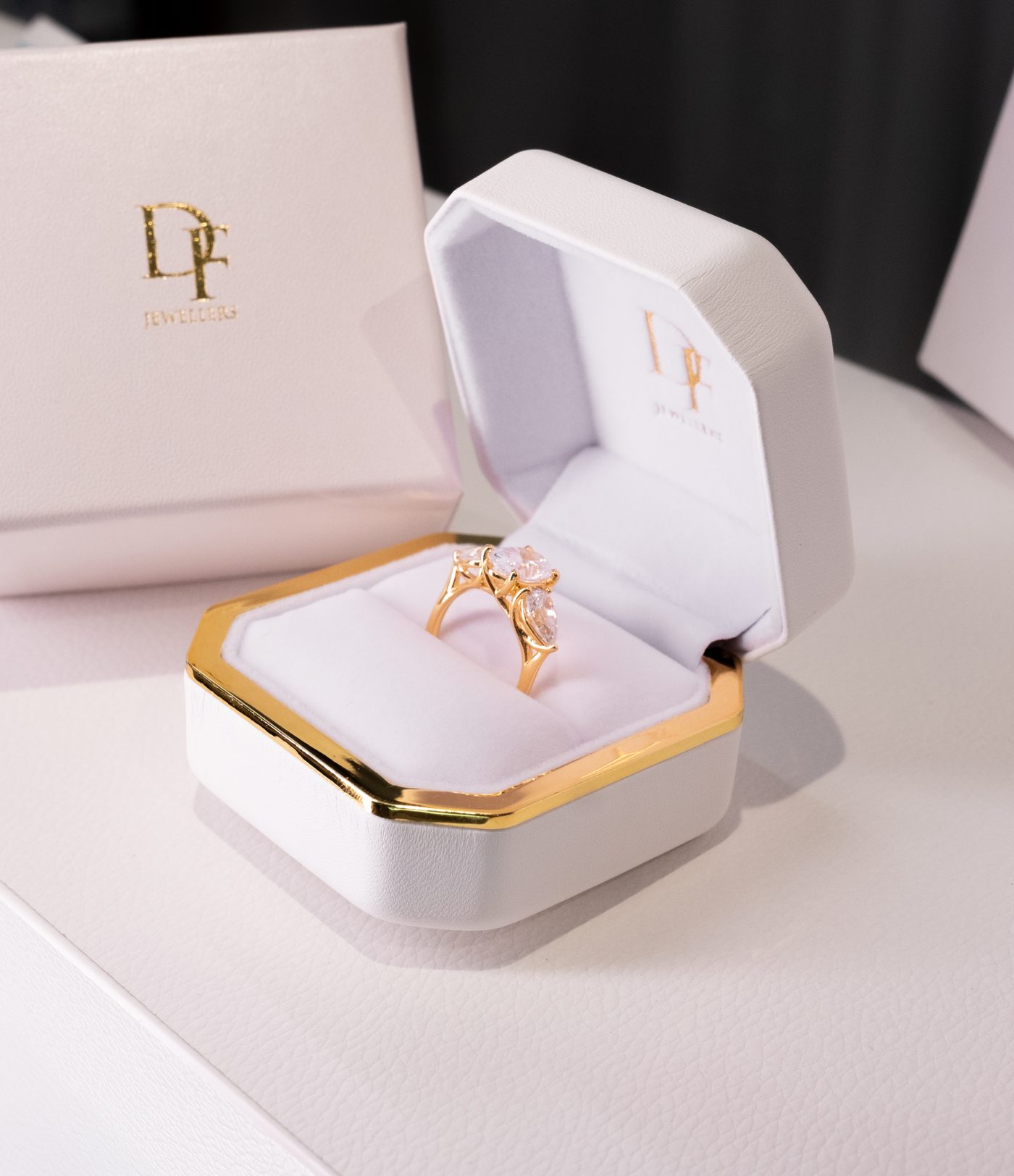 A Diamonds Factory ring box with a display ring inside